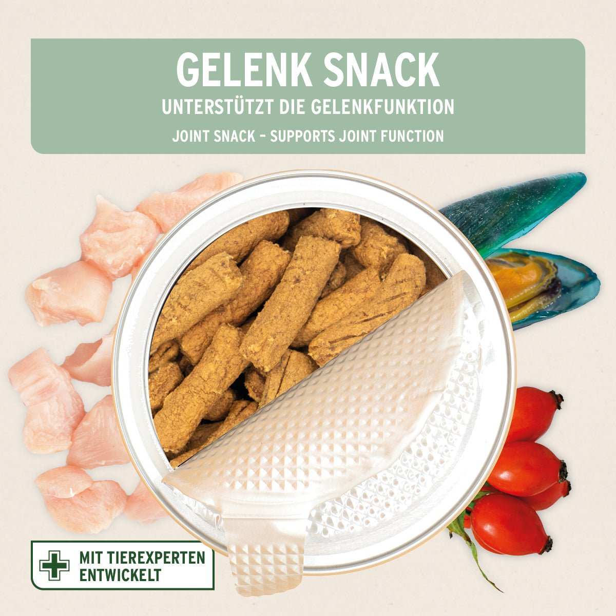 Von oben fotografierte Dose Gelenk - Snack - AniForte. Halb geöffnet mit Hagebutte, Grünlippmuschel und rohem Fleisch.