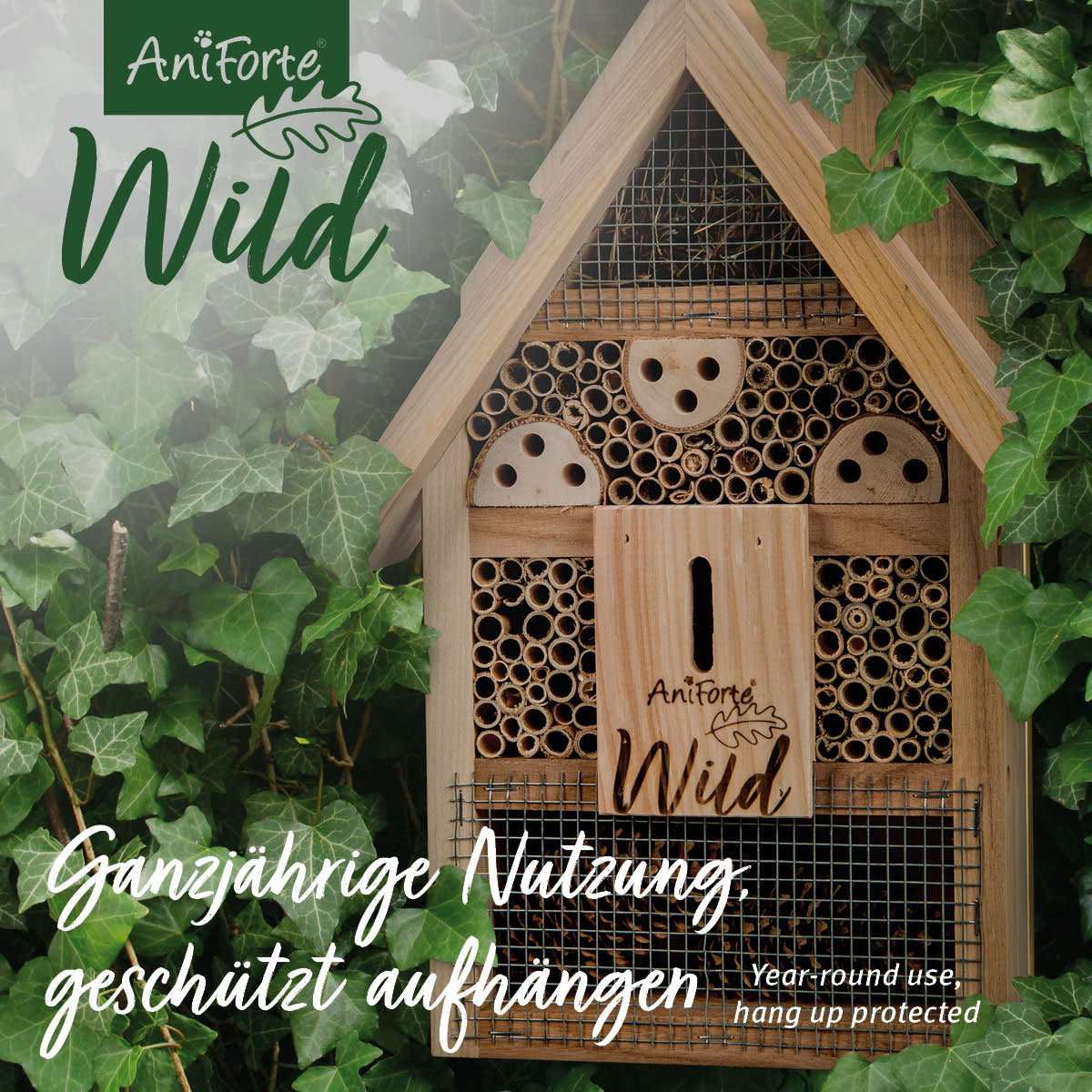 Insektenhotel aus Holz mit Lockmittel für Bienen, Wespen, Schmetterlinge, Käfer, Marienkäfer und Florfliegen im Garten.